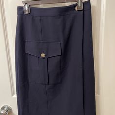 This Is A Navy Blue Cargo Pocket Wrap Utility Skirt In Size Small From Banana Republic. No Flaws. Size Small, Fits 4-6. Button At Each End Of Waist, For A True Wrap. Fully Lined. Navy Work Skirt With Pockets, Navy Workwear Skirt With Pockets, Fitted Blue Pencil Skirt With Pockets, Blue Office Skirt With Pockets, Utility Skirt, Blue Banana, Banana Republic Skirt, Cargo Pocket, Wrap Skirt