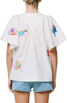 Colorful embroidery adds a vacation-ready twist to a woven cotton shirt in a relaxed silhouette. 24" length Button half placket Jewel neck Short sleeves 100% cotton Hand wash, dry flat Imported Asian & Pacific Islander Owned/Founded Casual Embroidered Top With Camp Collar, Embroidered Camp Shirt With Relaxed Fit For Vacation, Casual Embroidered Cotton Camp Shirt, Spring Vacation Embroidered Camp Shirt, Embroidered Vacation Tops With Camp Collar, Embroidered Camp Collar Shirt For Vacation, Embroidered Camp Shirt With Camp Collar For Vacation, Summer Embroidered Top With Camp Collar, Beach Embroidered Shirt With Camp Collar