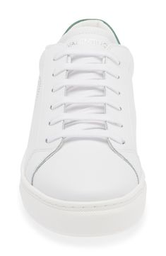 The brand's logo and a contrasting collar define a low-top sneaker shaped from smooth leather and secured with a classic lace-up closure. Leather upper/textile lining/synthetic sole Imported Valentino Sneakers Outfit Women, White Luxury Low-top Sneakers, Valentino White Sneakers, White Low-top Sneakers With Leather Trim, Valentino Sneakers, Mario Valentino, White Green, Smooth Leather, Low Top