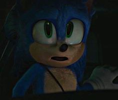 sonic the hedgehog is looking at something in the dark with green eyes and ears