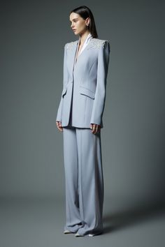 Crafted with premium quality materials, these pants offer a sophisticated and exclusive look. The ribbed crepe texture adds a touch of elegance, while the straight silhouette provides a flattering fit. Elevate your wardrobe with these timeless pants. Material: Crepe (White), Satin Crepe (Grey) *Product color is varied due to studio lighting. Elegant Semi-formal Pantsuit Trousers, Elegant Pantsuit With Pressed Crease Trousers, Elegant Wide-leg Workwear Suits, Elegant Suits With Straight Pants And Pressed Crease, Elegant Suits With Pressed Crease And Straight Pants, Elegant Evening Pantsuit With Ankle-length Pants, Elegant Wide-leg Suits With Pressed Crease, Luxury Tailored Trousers Pantsuit, Elegant Wide Leg Suits With Pressed Crease