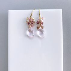 Free Shipping. Clear Rose Pink Quartz drop earrings made entirely by hand with real gemstones and 14k gold plated Italian silver. Very simple and easy to wear, these dangle earrings are perfect to throw on with anything and can be your everyday earring. They catch the light beautifully to add a hint of sparkle. STYLE DETAILS - Primary stone - Clear Pink Quartz - Gemstone Cluster - Mystic Rose Quartz, Pink Tourmaline, Champagne Quartz, Champagne Pearl - 1.5 inches long - French hooks with safety Gift Sets For Women, Rose Quartz Gemstone, Proposal Gifts, Pink Gemstones, Quartz Cluster, Cluster Earrings, Quartz Earrings, Pink Quartz, Rose Earrings