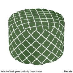 a green and white poufle with squares on it