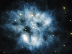 an image of some kind of cloud in the night sky with stars all around it