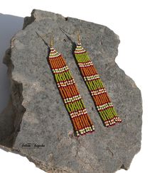 Olive green earrings Asymmetrical earring Green and gold Beaded earrings Mismatched earrings Striped earrings Long fringe earrings Long dangle earrings Tribal earrings Native earrings Statement earrings Seed bead earrings Beadwork earrings Asymmetrical beaded earrings in a beautiful and warm olive green-gold color scheme. If you need symmetrical earrings, then we are happy to make them for you in this or any other color scheme and the desired length. Let us know about it. Length of the Earrings Unique Green Long Drop Earrings, Bohemian Green Long Drop Earrings, Single Green Long Drop Earring, Green Single Long Drop Earring, Green Drop Earrings With Colorful Beads, Gold Beaded Earrings, Native Earrings, Gold Bead Earrings, Striped Earrings