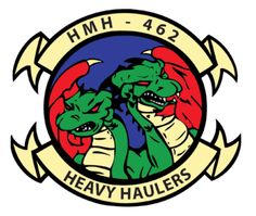 the logo for h mh - 462 heavy haulers, with two green dragon heads