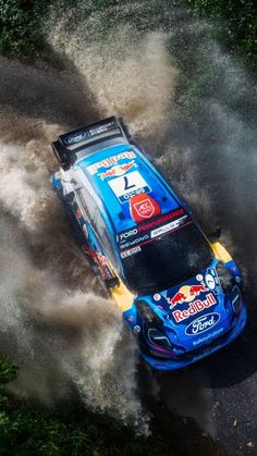 an aerial view of a racing car in the mud