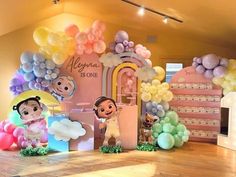 a room filled with balloons and decorations for children's birthdays or baby showers