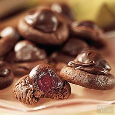 some chocolate cookies and jelly on a plate