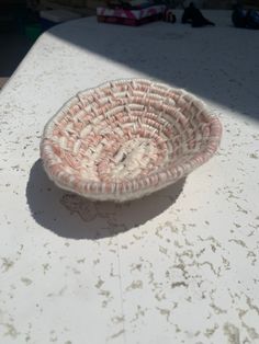 a small basket sitting on top of a table