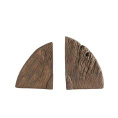 two pieces of wood that have been carved into the shape of a triangle, on a white background