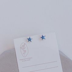 A beautiful blue crystal star earrings made with high quality solid 925 sterling silver. NOTE: You will only receive the blue star studs. The black and silver moon earrings are sold separately. See shop for more. PRODUCT DETAILS - Dimensions: 0.6 x 0.7 cm - Closure: Push back with butterfly backings - Main Material: 925 Sterling Silver - Stone: Cubic Zirconia  - Hypoallergenic - Nickel & Lead Free SHIPPING & PACKAGING Our jewelries are well packaged with care and will be shipped out within 1-3 business days via USPS.  Please don't hesitate to message us if you have any questions. We are fast to respond and would love to hear from you! Blue Star Earrings With Star Charm, Blue Star Charm Earrings As Gift, Blue Star Charm Earrings For Gift, Hypoallergenic Blue Star Earrings, Blue Star-shaped Celestial Earrings, Blue Star-shaped Celestial Jewelry, Blue Star-shaped Sterling Silver Earrings, Celestial Blue Star-shaped Jewelry, Blue Sterling Silver Star Earrings