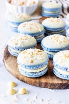 coconut macaroons with white frosting on a wooden platter and text overlay