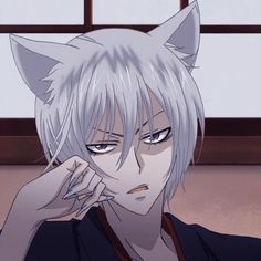 an anime character with white hair and cat ears, staring at the camera while holding his hand to his face