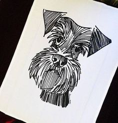 a black and white drawing of a dog's face on a piece of paper