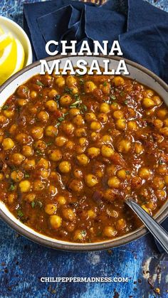 chickpeas masala in a bowl with lemon wedges on the side and text overlay that reads, chana masala