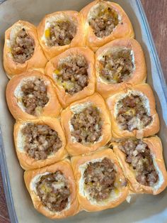 a baking dish filled with meat and cheese rolls