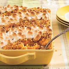 a casserole dish filled with thanksgiving stuffing and topped with marshmallows