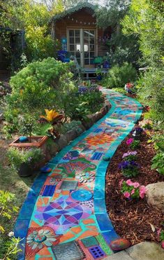 a colorful walkway in the middle of a garden