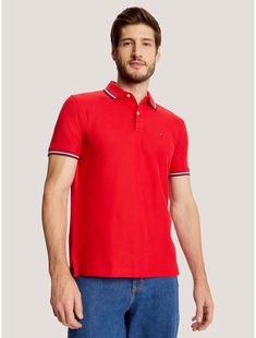 Tommy Hilfiger men's polo. A fresh spin on tradition, this regular fit polo is made from quick-dry, wicking fabric with ultraviolet protection and features our signature stripe tipping at the cuffs and collar. Comfort? Check. Performance? Style? Check.  Material: 60% Cotton. Red Short Sleeve Polo Shirt With Ribbed Collar, Classic Red Polo Shirt With Striped Collar, Classic Three-stripes Polo Shirt, Classic Three Stripes Polo Shirt, Classic Polo Shirt With Striped Collar For Golf, Golf Polo Shirt With Three Stripes, Collared Polo Shirt With Contrast Stripes For Golf, Sporty Polo Shirt With Striped Collar For Golf, Sporty Golf Polo Shirt With Striped Collar