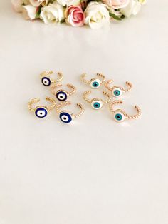 "Adjustable evil eye ring, minimalist evil eye ring, dainty ring, blue evil eye, white evil eye, evil eye jewelry, joint rings, greek evil eye 🌟 Please choose evil eye bead color & Band color accordingly; - Blue Evil Eye - White Evil Eye - Rose Gold Band - Gold Band 🌟 These evil eye rings are ADJUSTABLE. These are suitable for every sizes. 🌟 These evil eye rings can be used as JOINT RINGS as well. ------------------------------ SHIPPING POLICY DETAILS: Processing Times: Once payment is co Blue Open Ring Metal Jewelry, Blue Metal Open Ring Jewelry, Nickel-free Blue Open Ring Jewelry, Adjustable Blue Open Ring Jewelry, Handmade Blue Toe Ring Jewelry, Blue Stackable Open Midi Rings, Handmade Blue Open Midi Ring, Blue Stackable Midi Rings As A Gift, Blue Stackable Midi Rings For Gift