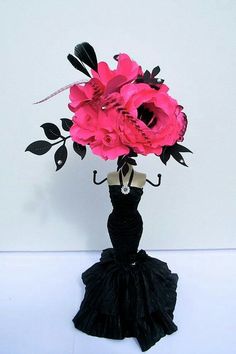 a black dress with pink flowers in it and an umbrella on the top of it