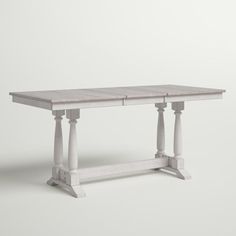 a white table with two pillars on each end