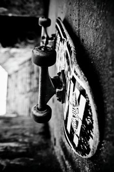 a skateboard hanging on the side of a wall