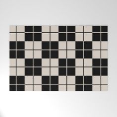 a black and white checkerboard pattern on a wall