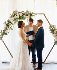 Hexagon, wedding, arch wedding ceremony, bride, and groom Hexagon Decorations Wedding, Hexagon Wedding Arch Flowers White, Hexagon Wedding Arch Eucalyptus, Hexagon Wedding Arch White Flowers, Hexagon Arch Florals, Hexagon Wedding Arch Decoration Ideas, Hexagon Flower Arch, Hexagon Arch Flowers