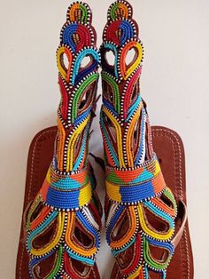 Unique Gift | Sandals | Gladiator Sandals | Greek Sandals | Beach Jewelry | Wedding Shoes | Leather Sandals | Custom | Mothers GiftAn elegant and authentic pair of African inspired beaded ladies sandals, with a unique and eye-catching design. 100% genuine leather. *100% genuine leather.Main Color - Multicolored. ✂⋯⋯ S I Z E  C H A R T ⋯⋯✂EU.........USA........UK.........CM............INCHES34..........3.5...........1.5.........22.3...........8.835..........4.5...........2.5........23............ Handmade Traditional Ankle Strap Sandals, Traditional Multicolor Ankle Strap Sandals, Traditional Open Toe Barefoot Sandals For Festivals, Traditional Ankle Strap Sandals For Festival, Traditional Handmade Ankle Strap Sandals, Artisan Multicolor Open Toe Sandals, Traditional Multicolor Leather Sandals, Artisan Handmade Multicolor Sandals, Traditional Handmade Multicolor Huarache Sandals