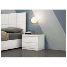 a bedroom with a bed, nightstand and night stand in white finish on the wall