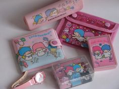 hello kitty stationery set in pink and blue with various items on the counter top