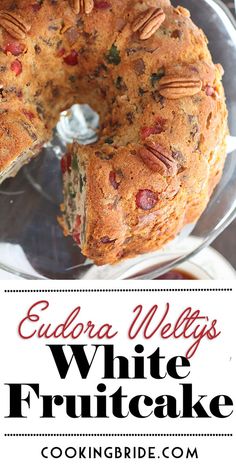 a cake with pecans on top and the words eudora welty's white fruitcake