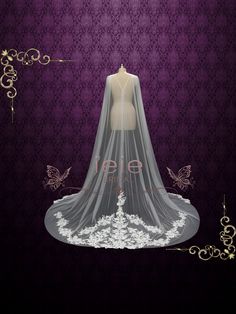 a wedding dress with veil and butterflies on the wall in front of an ornate purple background