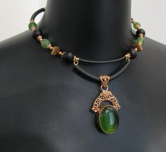 Vintage style copper lace pendant necklace and earring set/green jade and copper jewelry set/vintage copper pendant set memory wire choker/gift for her designer necklace/ooak Handmade jewelry set Necklace with pendant and earrings Copper lace pendant with green quartz and necklace on memory wire with green jade beads, black agate beads, artisan copper beads, copper color metal beads and silicone cord. Lightweight, not heavy at all. Earrings with jade, agate and copper beads. Necklace length aprox. 17 in (with extension chain) Earrings length: 2,5 in Vintage Jade Jewelry For Jewelry Making, Vintage Jade Pendant Jewelry, Antique Jade Jewelry For Gift, Antique Jade Jewelry As A Gift, Vintage Green Copper Jewelry, Green Vintage Copper Jewelry, Green Copper Jewelry For Jewelry Making, Elegant Green Copper Necklace, Vintage Green Wire Wrapped Jewelry