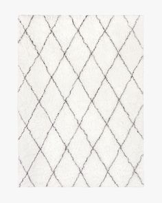 a white rug with black lines on it