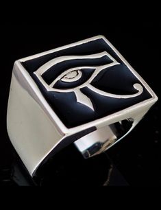 high quality Sterling silver ring high polished marked 925 design: Sterling silver men's ring Eye of Ra ancient Egypt symbol All Seeing Eye of Horus with Black enamel dimensions: 17 mm along the finger x 19 mm wide (17mmx19mm) average weight: 26 grams depending on the size Symbolic Signet Ring With Polished Finish, Silver Sterling Silver Signet Ring With Black Enamel, Silver Sterling Enamel Ring With Black Enamel, Silver Sterling Enamel Ring With Black Detail, Eye Of Ra, Sterling Silver Mens Rings, Seeing Eye, All Seeing Eye, Eye Of Horus