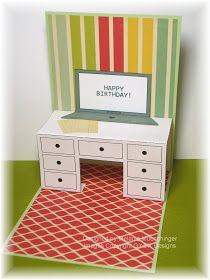 a birthday card with a desk and drawers