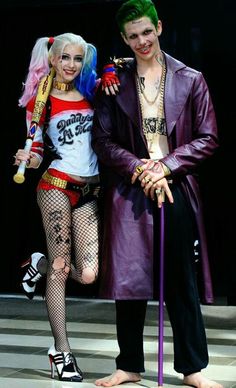 two people dressed in costumes standing next to each other