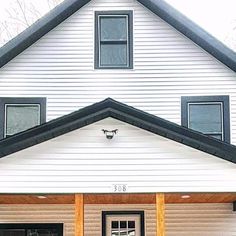 a white house with black trim and windows