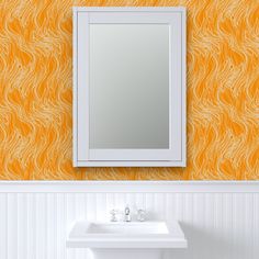 a white sink sitting under a bathroom mirror next to a wall mounted faucet