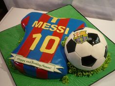 a birthday cake with a soccer ball and jersey on it