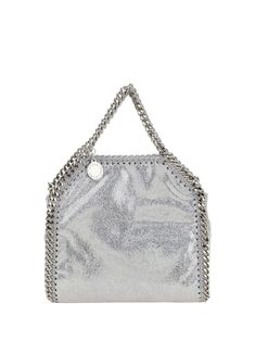 Tiny shaggy tote shoulder bag by stella mccartney, the brand's iconic faux leather design, chain trim on the bag's trim, chain top handles, interior snap-button closure, single interior compartment, metal pendant attached to the base of the handle with iconic engraved logo. Composition: 100% % Polyester | Stella McCartney Women's Tiny Shaggy Tote Shoulder Bag in Silver | SS24 Logo Composition, Chain Top, Engraved Logo, Metal Pendant, Chic Woman, Leather Design, Luxury Retail, Luxury Boutique, Snap Button