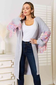 Fringe Retro Waffle Knit Cardigan Sleeve Colorful Open Front Sweater Duster This cozy upgraded classic longline cardigan is a timeless wardrobe staple.Effortless pairing with your favorite tops and jeans.The solid waffle knit with contrasting bright colors will add that touch every outfit is missing.Fringe addition to each sleeve gives a bohemian retro vintage vibe.Open front front and juliet long-sleeves with a ribbed hem.Hidden slit side hip pockets make this practical and fashionable.Perfect Trendy Fringe, Shoulder Cardigan, Drop Shoulder Cardigan, Curve Model, 2023 Christmas, Cozy Cardigan, Shoulder Design, Basic Style, Christmas Presents