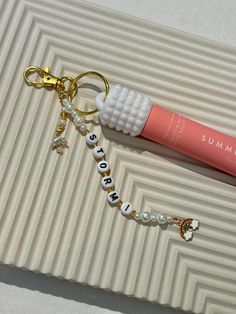 Add a touch of sparkle and personality to your keys or bags with a customizable lip gloss cap keychain! Choose your personalization and up to two high quality 14k gold charms to create a unique accessory that's perfect for you or as a gift.  *LIP BALM NOT INCLUDED Summer Fridays Keychain, Sisterhood Events, Lip Balm Keychain, Summer Fridays Lip, Girly Bracelets, Key Cap, Gold Charms, Summer Fridays, Birthday Wishlist