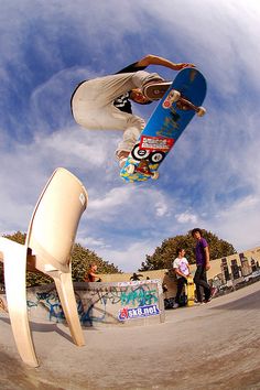 a man flying through the air while riding a skateboard