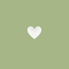 a white heart on a green background