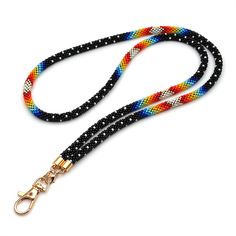 This black beaded teacher lanyard for badge is made of Japanese seed beads of superior quality beads.Lanyards are perfect for keys, ID cards, badges, name tags, keychains, usb, passport, whistle, compass, ticket, camera, phone, wallet.Step up your style game with Native Americaninspired jewelry pieces! With intricate crochet beadwork, these colorful and unique pieces capture the beauty of Native American culture. Show off your bold personality and stand out in the crowd with our exclusive collec Black Beaded Adjustable Lanyards, Handmade Black Lanyards For Personal Use, Black Lanyard With Key Leash For Personal Use, Black Lanyard With Lobster Clasp As Gift, Black Lanyard With Key Leash As Gift, Black Beaded Lanyards For Gift, Black Beaded Lanyards As Gift, Black Beaded Lanyard As Gift, Lanyard Tutorial