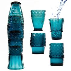 blue glass vases and glasses with water splashing from the top one to the bottom